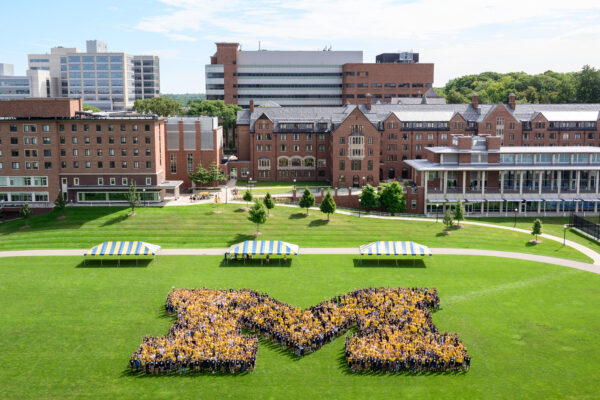 The incoming freshman class creates a Block M on Palmer Field