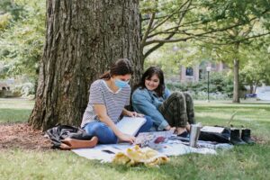 Two students study outside