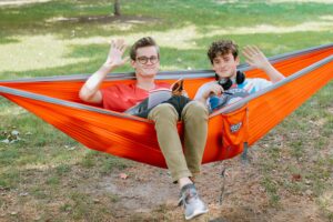 Two students study in a hammock