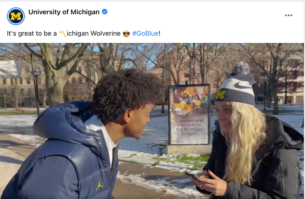 Screenshot of a Facebook video showing two students celebrating