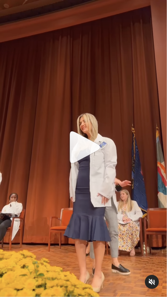 Screenshot of an Instagram Reel of a pharmacy student putting on a white coat.